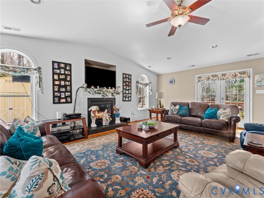10488 Old Telegraph Road Ashland, VA 23005 - Photo 26 of 69 a living room with furniture fireplace and a flat screen tv