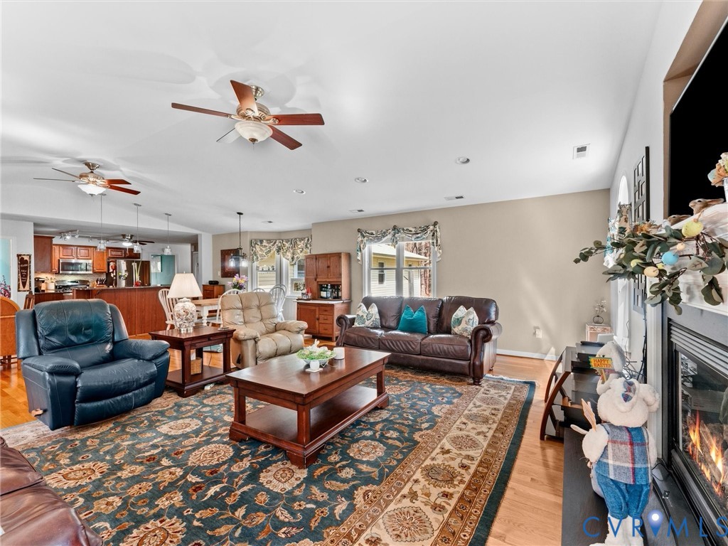 10488 Old Telegraph Road Ashland, VA 23005 - Photo 27 of 69 a living room with furniture a flat screen tv and a table