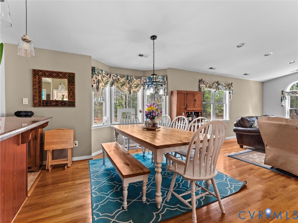 10488 Old Telegraph Road Ashland, VA 23005 - Photo 29 of 69 a view of a dining room with furniture window and wooden floor