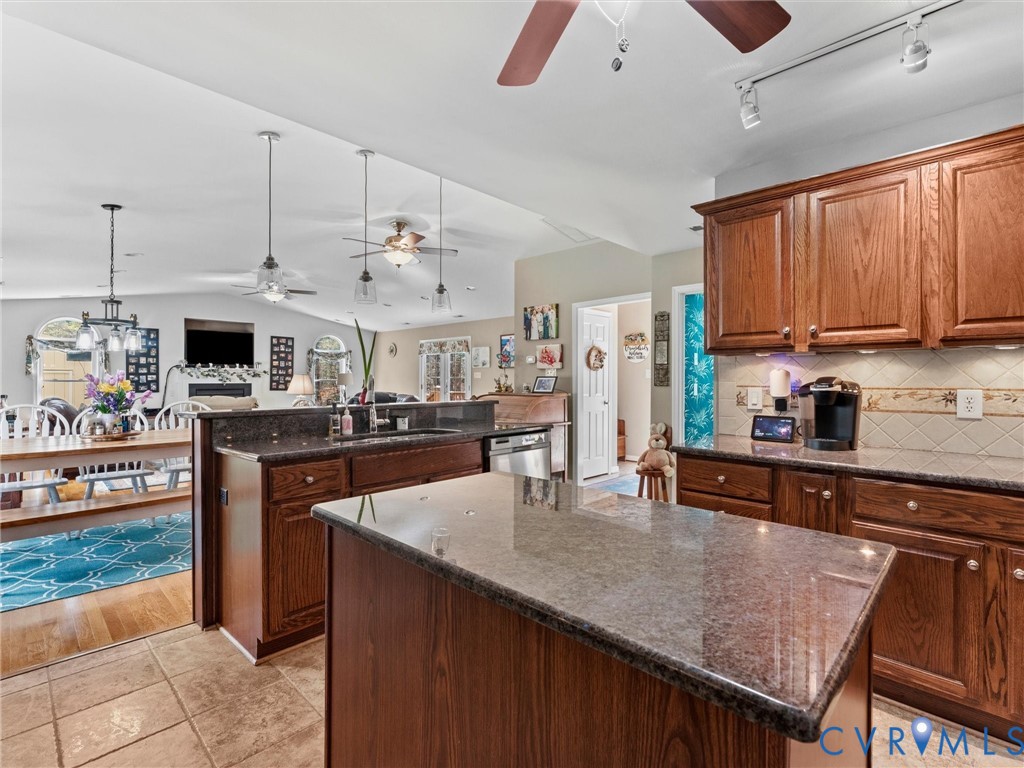 10488 Old Telegraph Road Ashland, VA 23005 - Photo 34 of 69 a kitchen with stainless steel appliances granite countertop a sink a stove and a refrigerator