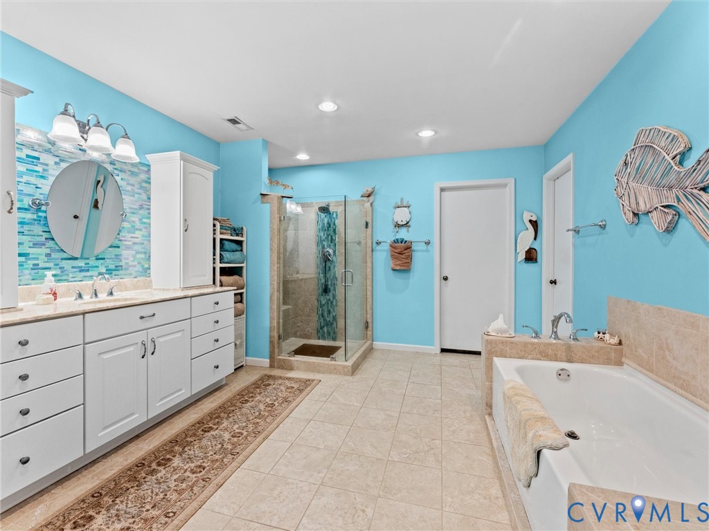 10488 Old Telegraph Road Ashland, VA 23005 - Photo 47 of 69 a spacious bathroom with a double vanity sink mirror and shower