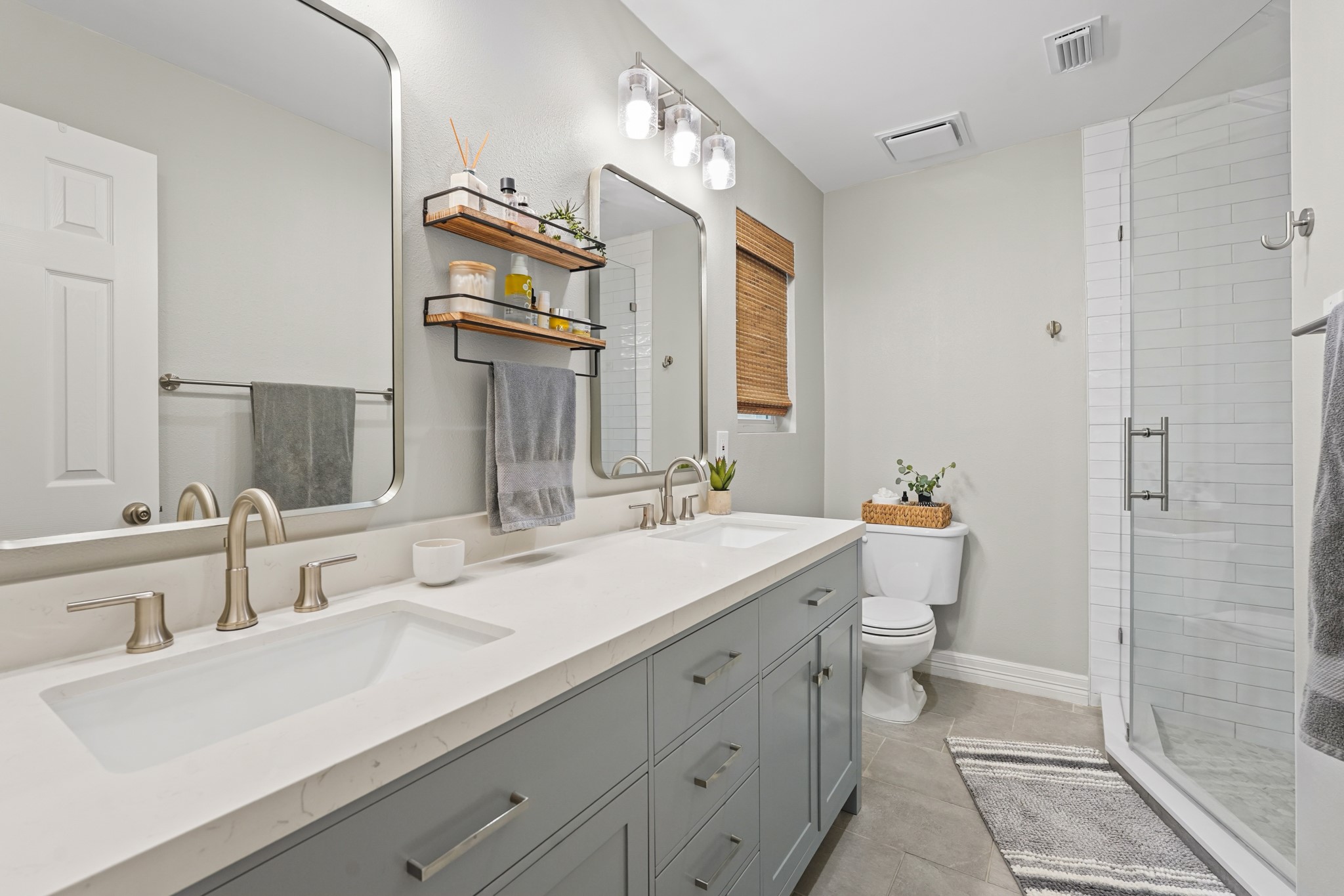 5242 Sanford Road Houston, TX 77035 - Photo 20 of 34 Newly renovated primary bathroom! New paint, tile, double sinks, fixtures, hardware and shower! What a beauty!