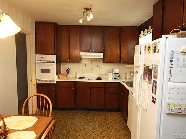1343 Sedwick Road Durham, NC 27713 - Photo 4 of 14 Spacious eat-in kitchen. Equipped with refrigerator, dishwasher, electric range and electric oven.