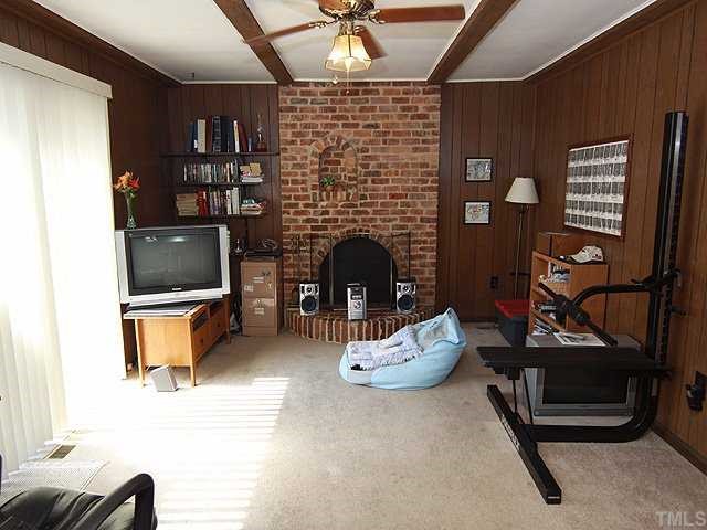 1343 Sedwick Road Durham, NC 27713 - Photo 7 of 14 Den has fireplace with brick hearth. Second living area offers additional space for exercise, homework, hanging out.