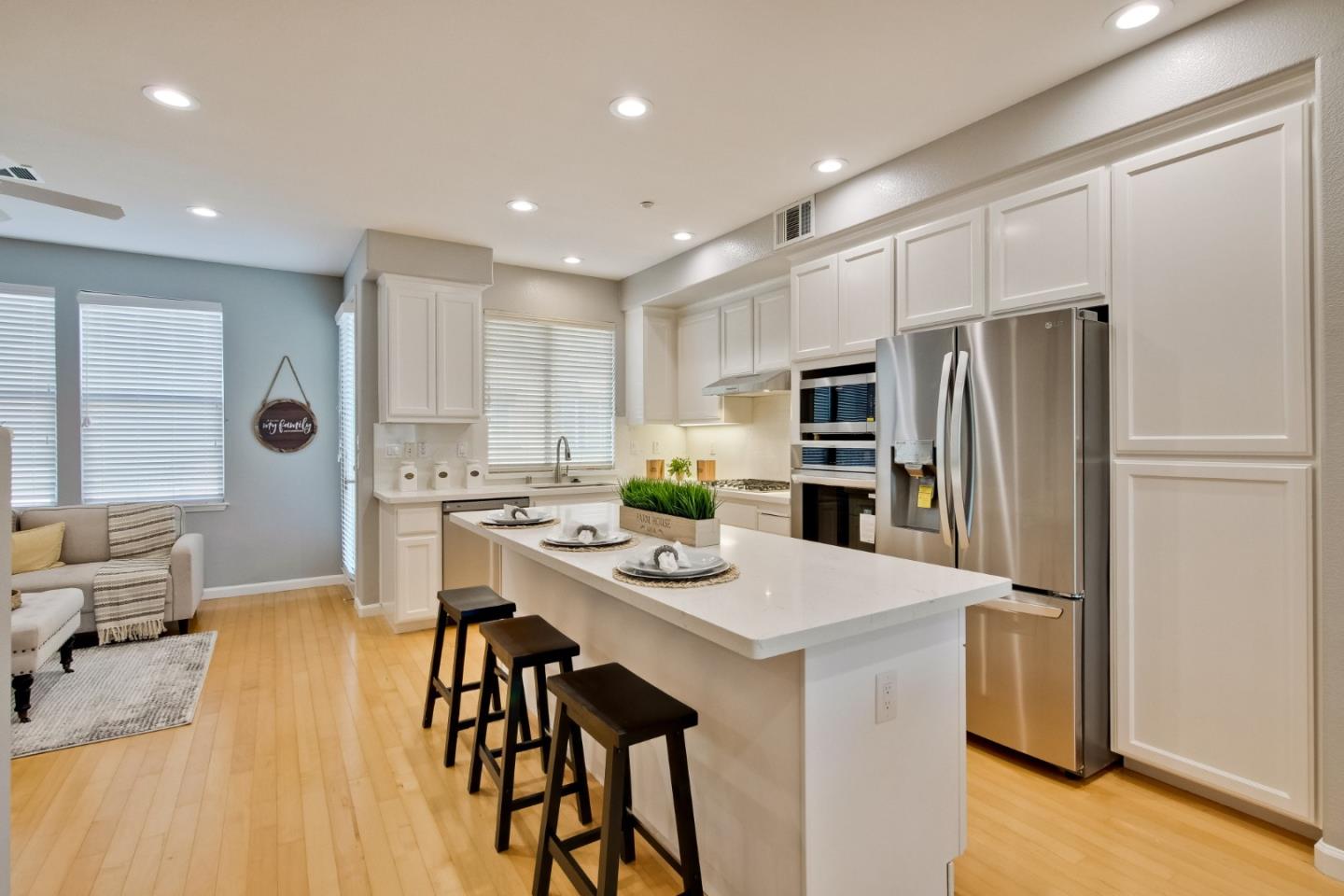 2488 Millstream Lane San Ramon, CA 94582 - Photo 20 of 65 a kitchen with stainless steel appliances kitchen island granite countertop a refrigerator and a stove top oven