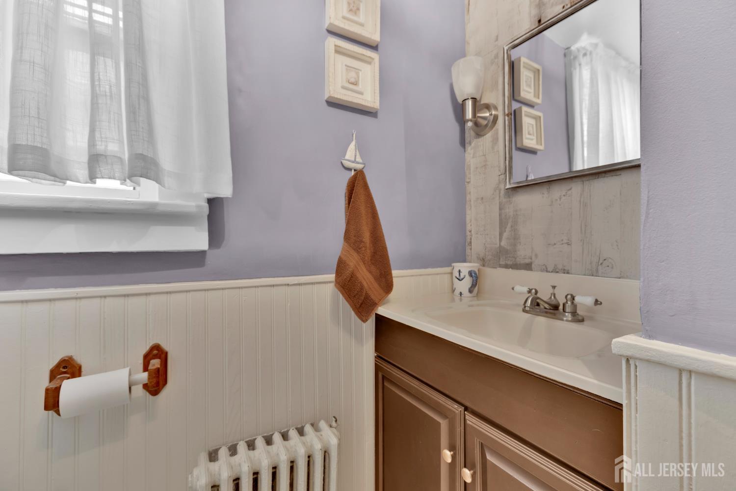 18 Pine Street Keyport, NJ 07735 - Photo 22 of 31 a bathroom with a sink and a mirror