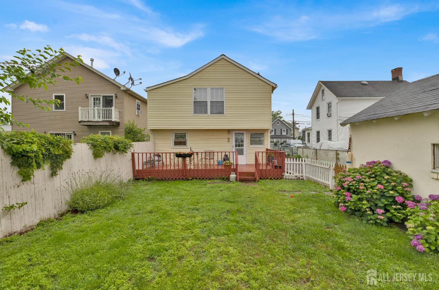 18 Pine Street Keyport, NJ 07735 - Photo 7 of 31 a view of a house with a yard and sitting area
