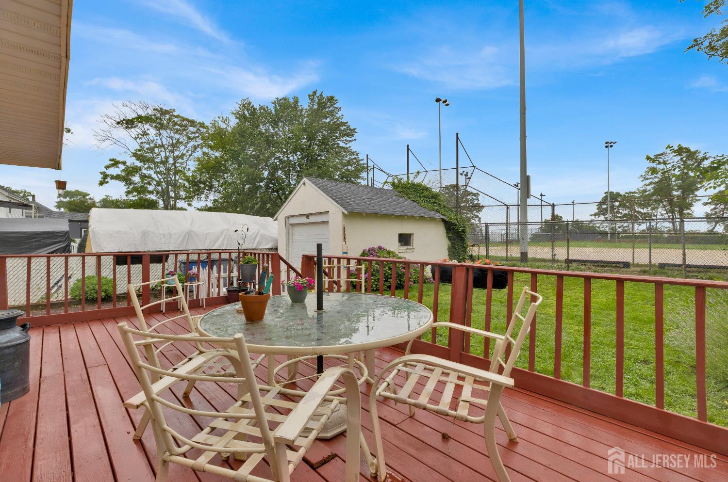 18 Pine Street Keyport, NJ 07735 - Photo 10 of 31 a view of a balcony with wooden floor and outdoor seating
