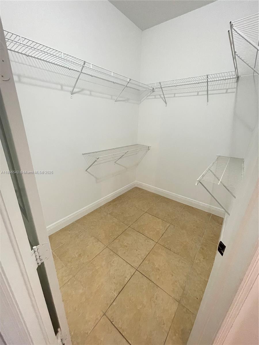 8290 Northwest 39th Court, Unit 8290 Cooper City, FL 33024 - Photo 15 of 19 a view of a room with racks on the wall