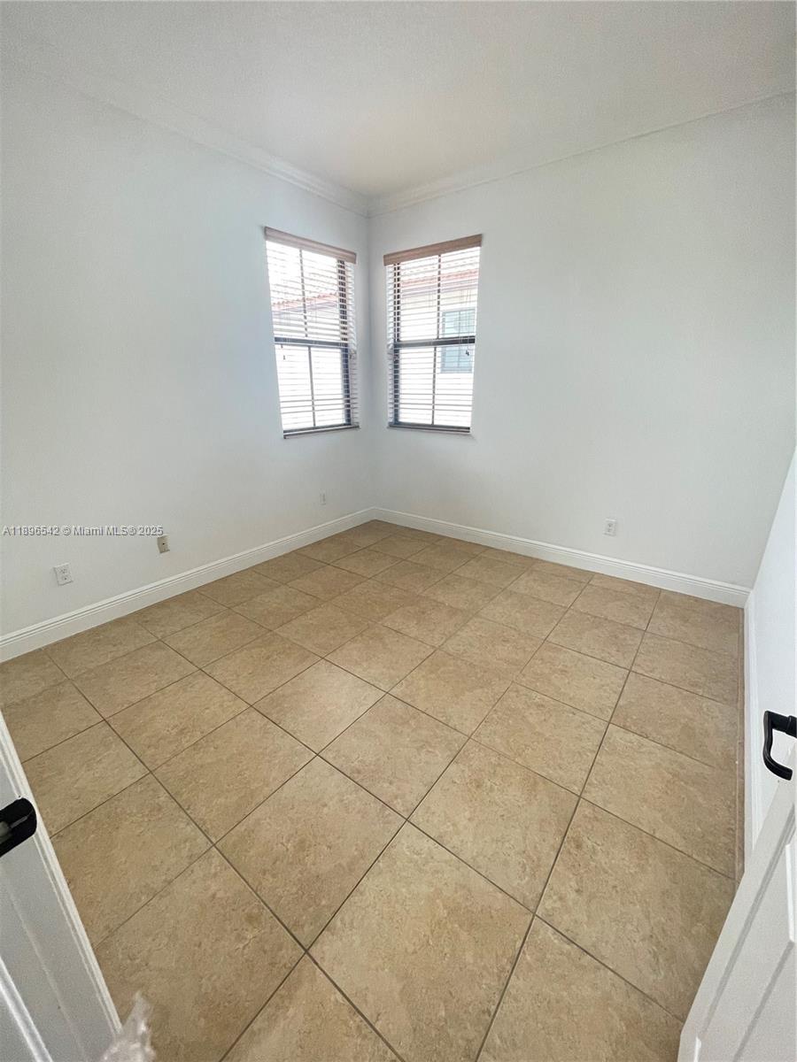 8290 Northwest 39th Court, Unit 8290 Cooper City, FL 33024 - Photo 17 of 19 an empty room with windows