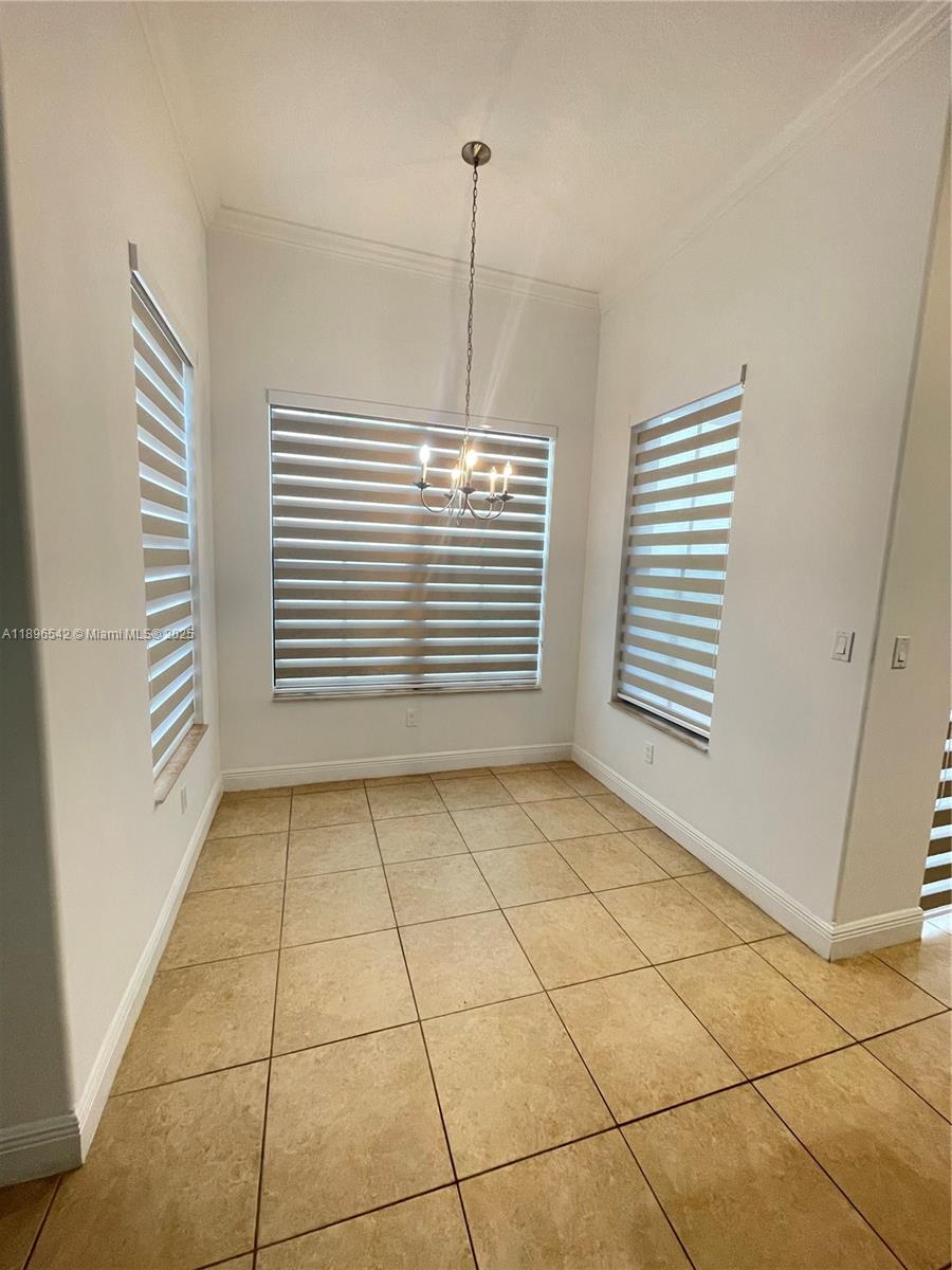 8290 Northwest 39th Court, Unit 8290 Cooper City, FL 33024 - Photo 5 of 19 a view of an empty room with a window
