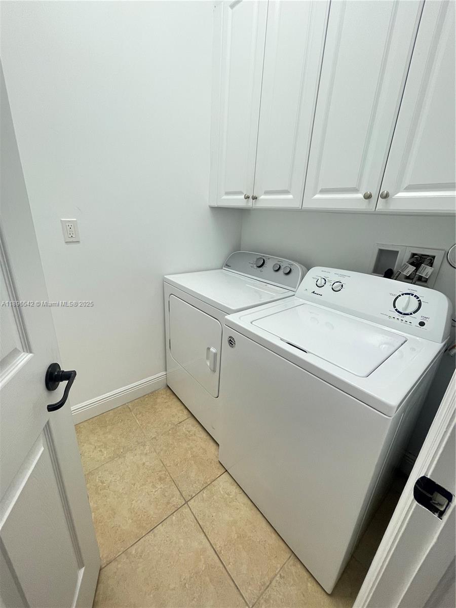 8290 Northwest 39th Court, Unit 8290 Cooper City, FL 33024 - Photo 8 of 19 a utility room with dryer and washer