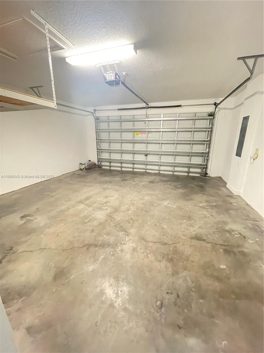 8290 Northwest 39th Court, Unit 8290 Cooper City, FL 33024 - Photo 9 of 19 a view of a garage