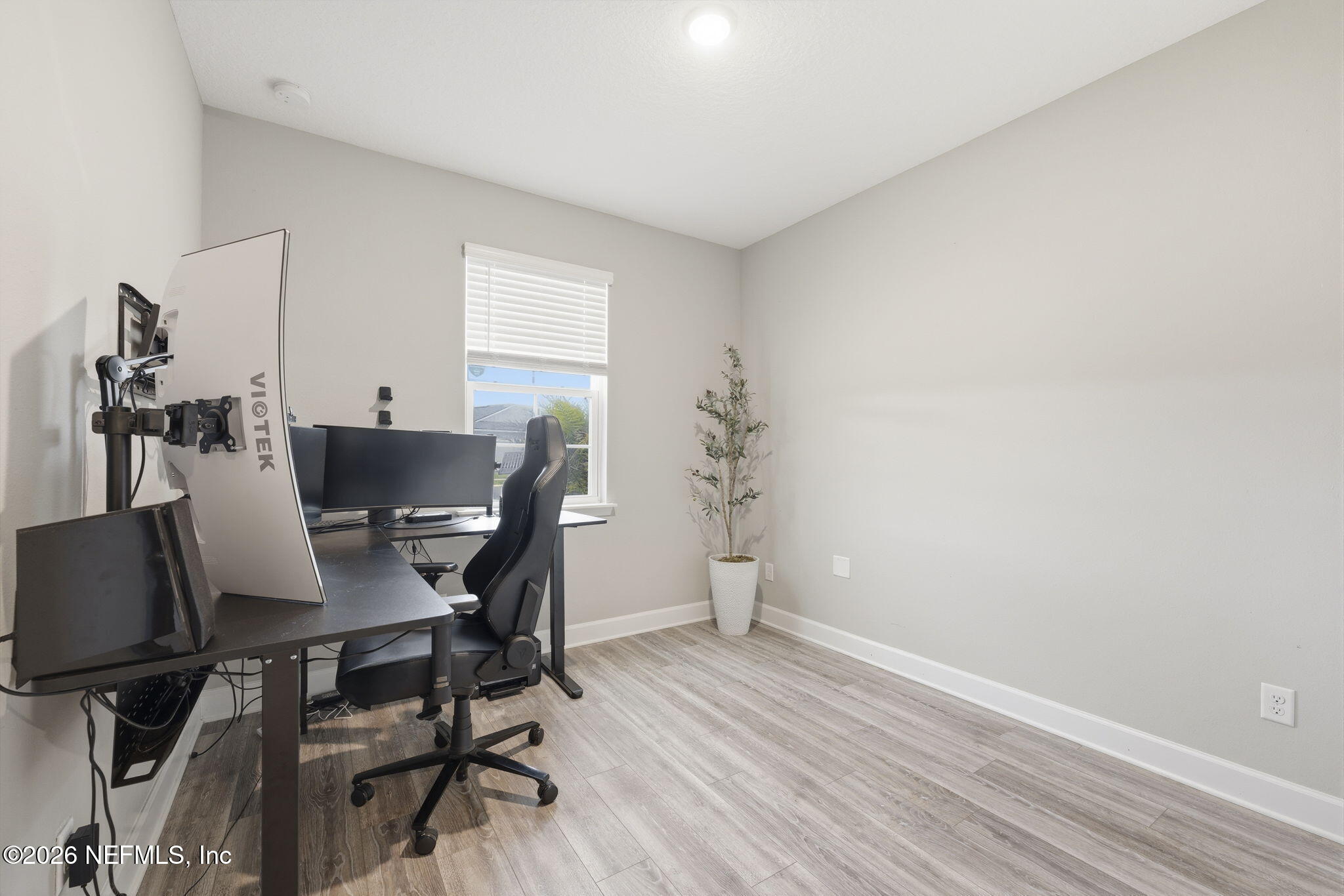 301 Field Flower Way St. Augustine, FL 32092 - Photo 7 of 58 a workspace with furniture and wooden floor