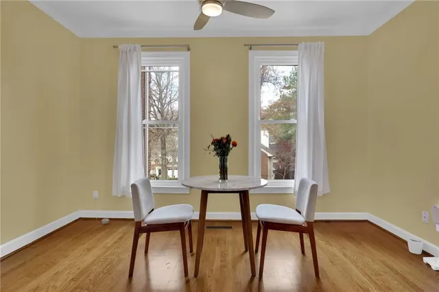 a view of a room with furniture window and wooden floor