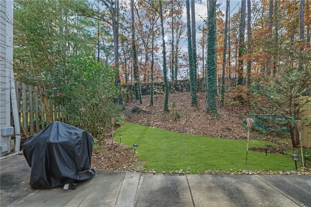 a backyard of a house with outdoor seating