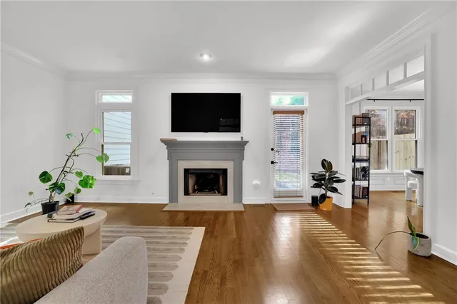 a living room with furniture and a fireplace