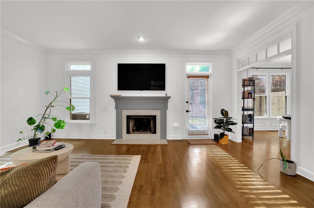 7155 Roswell Road, Unit 14 Atlanta, GA 30328 - Photo 6 of 35 a living room with furniture and a fireplace