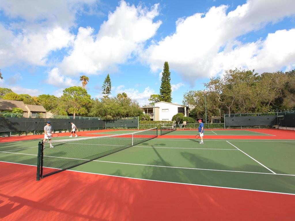 1512 Pelican Cove Road, Unit 239 Sarasota, FL 34231 - Photo 22 of 29 a view of a tennis court
