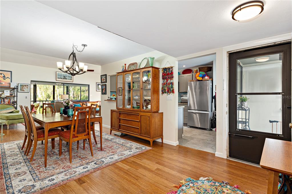 1512 Pelican Cove Road, Unit 239 Sarasota, FL 34231 - Photo 5 of 29 a view of a dining room with furniture