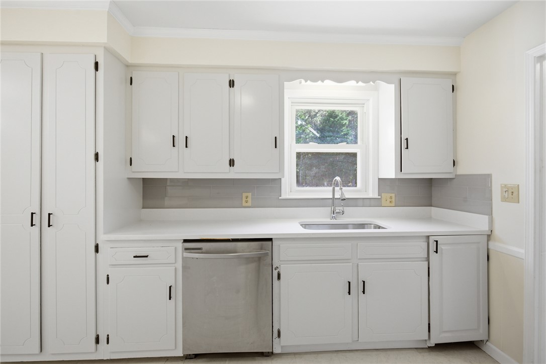 207 Greenmeadow Circle Anderson, SC 29626 - Photo 11 of 38 This bright kitchen features ample cabinetry and a window above the sink.