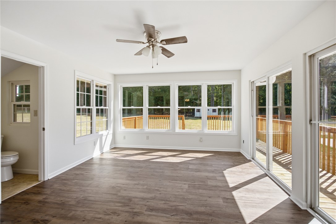 207 Greenmeadow Circle Anderson, SC 29626 - Photo 13 of 38 This bright sunroom offers expansive views and seamless indoor-outdoor living. It can also be used as dining area.