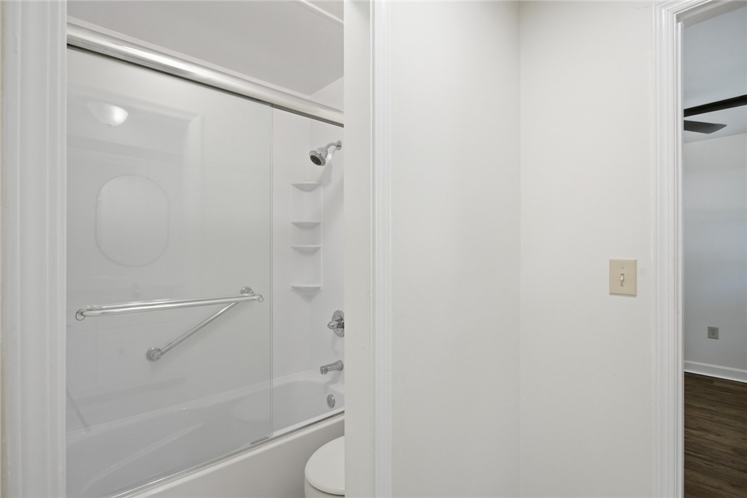 207 Greenmeadow Circle Anderson, SC 29626 - Photo 23 of 38 This clean and inviting bathroom offers a shower-tub combination with essential grab bars for convenience.
