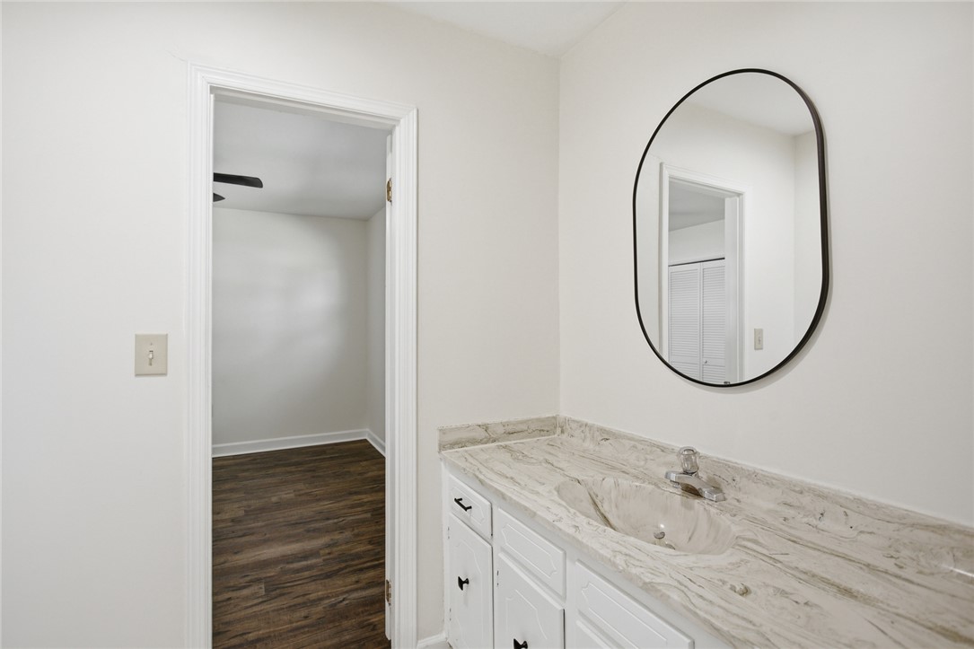 207 Greenmeadow Circle Anderson, SC 29626 - Photo 24 of 38 This bathroom features a contemporary vanity with an elegant countertop and a sleek, modern mirror.