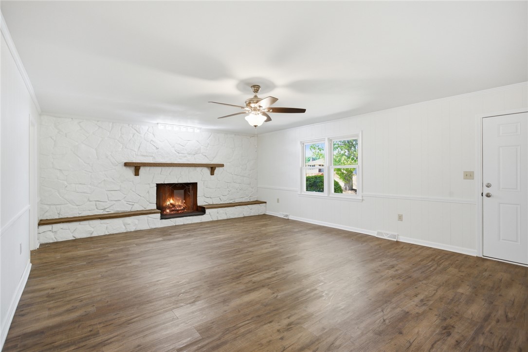 207 Greenmeadow Circle Anderson, SC 29626 - Photo 3 of 38 Bright and airy living room with a charming fireplace, perfect for cozy gatherings.