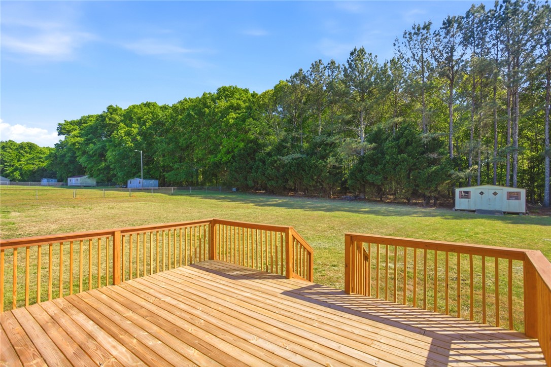 207 Greenmeadow Circle Anderson, SC 29626 - Photo 31 of 38 This spacious deck overlooks a verdant landscape, offering a serene outdoor retreat.