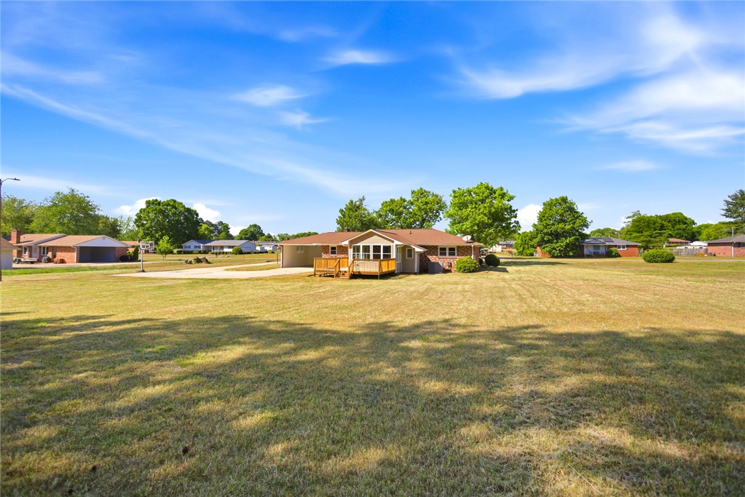 207 Greenmeadow Circle Anderson, SC 29626 - Photo 37 of 38 This spacious property features a charming brick home with a large yard, perfect for outdoor enjoyment.
