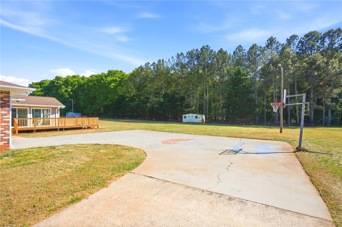 207 Greenmeadow Circle Anderson, SC 29626 - Photo 38 of 38 This property features an expansive outdoor court and ample green space, perfect for recreation and relaxation.