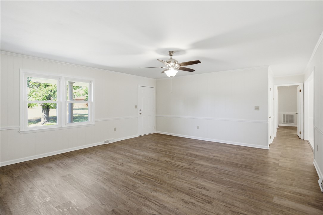 207 Greenmeadow Circle Anderson, SC 29626 - Photo 4 of 38 This bright and airy room features durable flooring and ample natural light, creating a welcoming atmosphere.