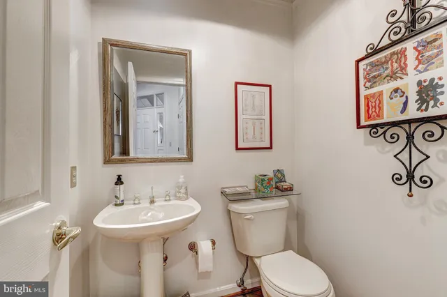 a living room with furniture fireplace and wooden floor