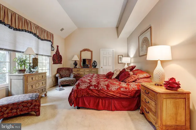 a bedroom with furniture and a window