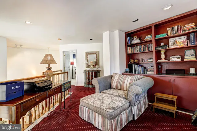 a spacious bedroom with a bed and a flat screen television