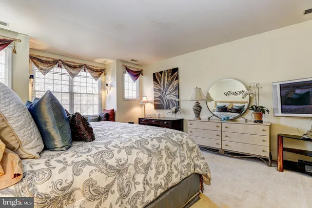 a view of a house with large trees