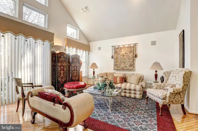 a living room with furniture or couch and a large window