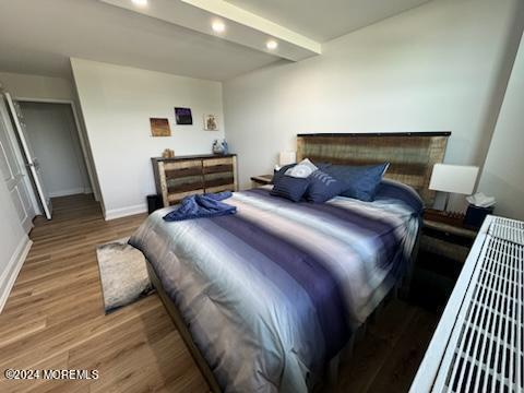 675 Ocean Avenue, Unit 3I Long Branch, NJ 07740 - Photo 22 of 35 a bedroom with a bed and wooden floor