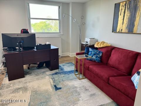 675 Ocean Avenue, Unit 3I Long Branch, NJ 07740 - Photo 23 of 35 a living room with furniture and a window