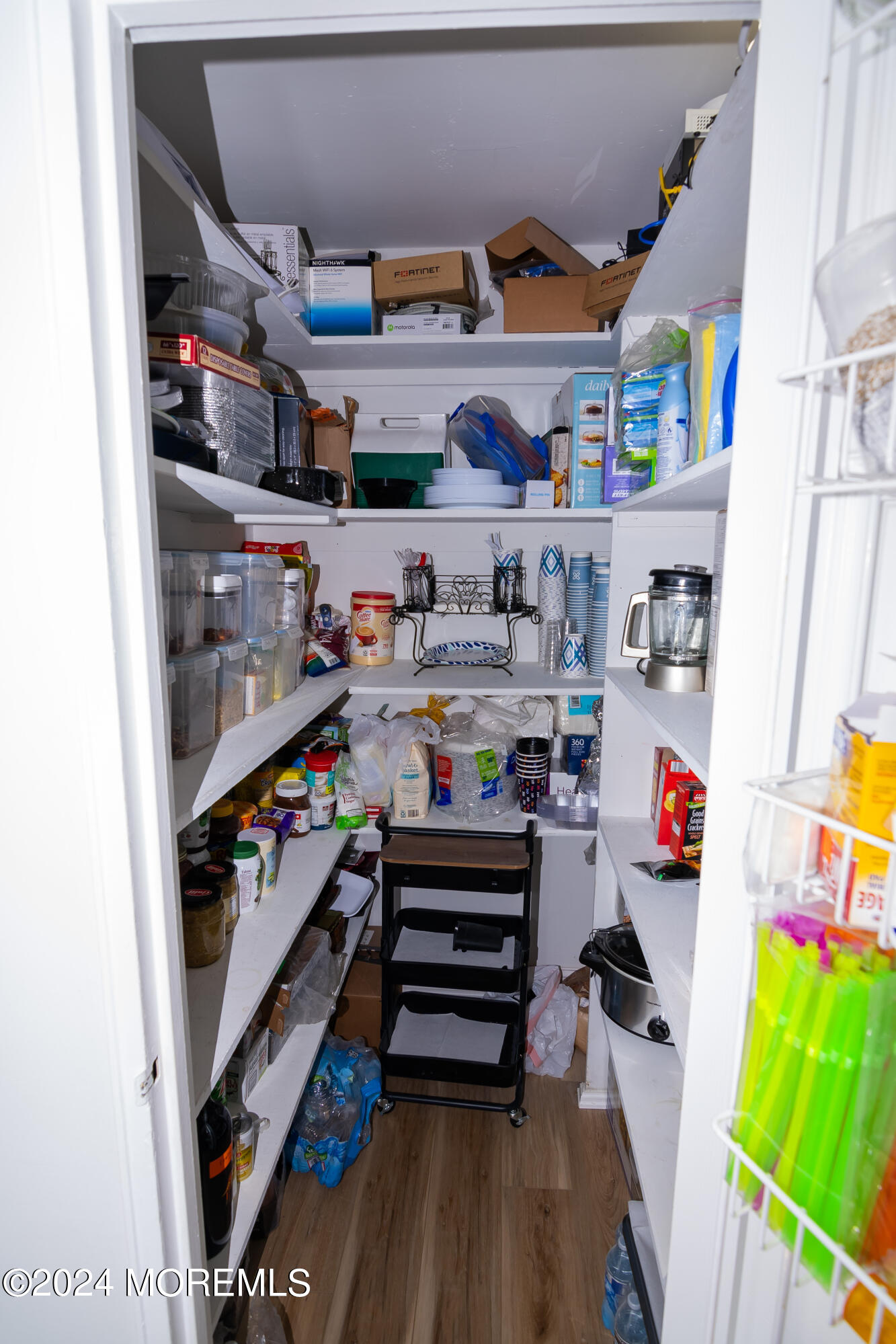 675 Ocean Avenue, Unit 3I Long Branch, NJ 07740 - Photo 25 of 35 a room with lots of different colored cloths