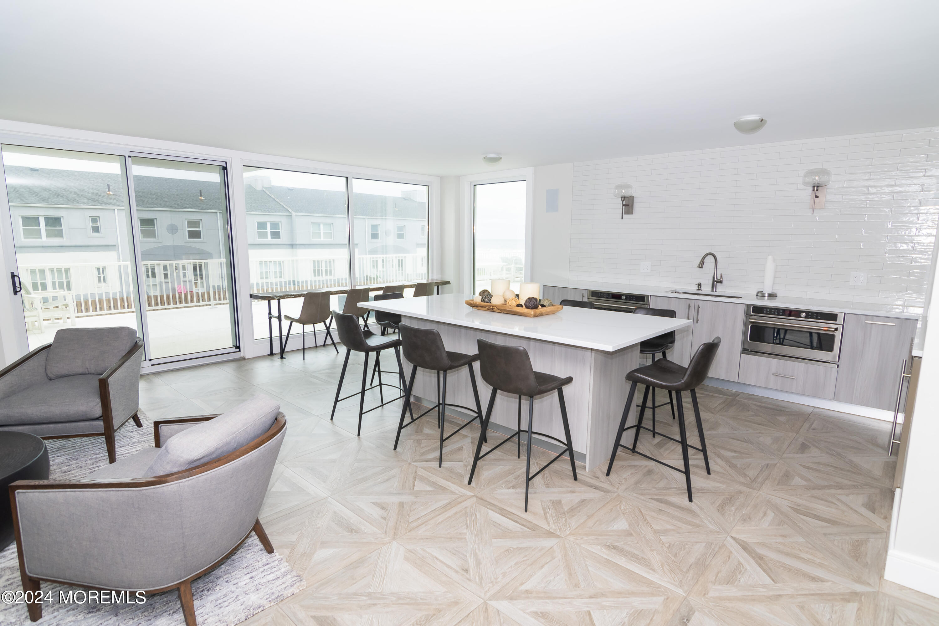 675 Ocean Avenue, Unit 3I Long Branch, NJ 07740 - Photo 29 of 35 a view of a dining room with furniture and wooden floor