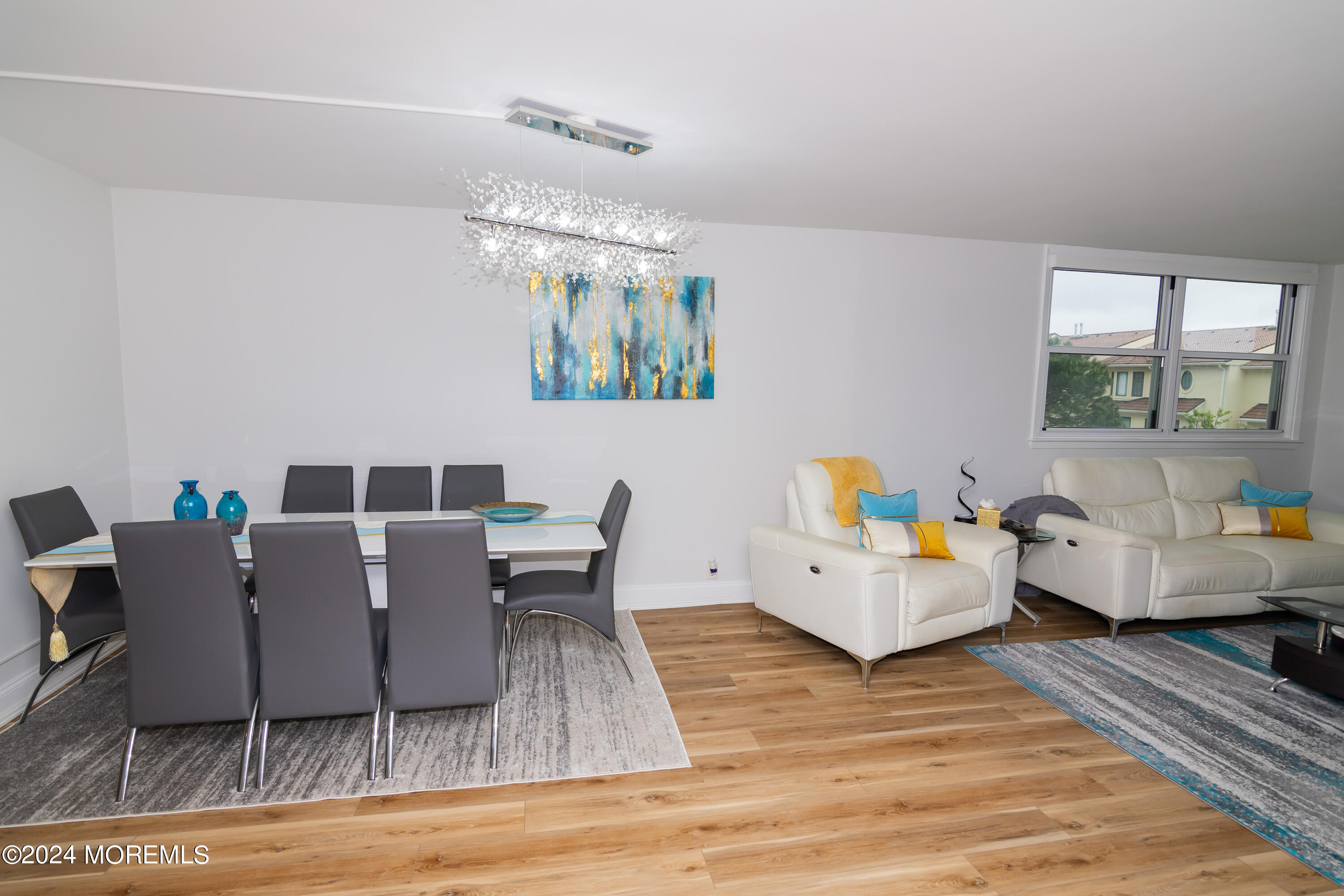 675 Ocean Avenue, Unit 3I Long Branch, NJ 07740 - Photo 7 of 35 a living room with furniture and a table