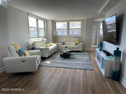 675 Ocean Avenue, Unit 3I Long Branch, NJ 07740 - Photo 8 of 35 a living room with furniture and a flat screen tv