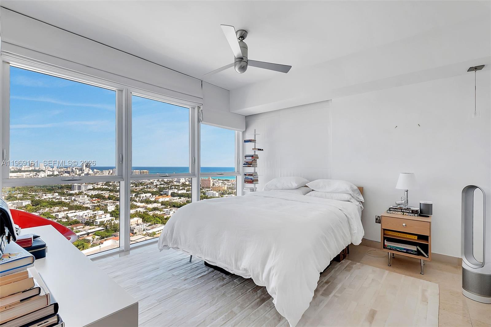 450 Alton Road, Unit 3208 Miami Beach, FL 33139 - Photo 8 of 48 a bedroom with a bed and a large window
