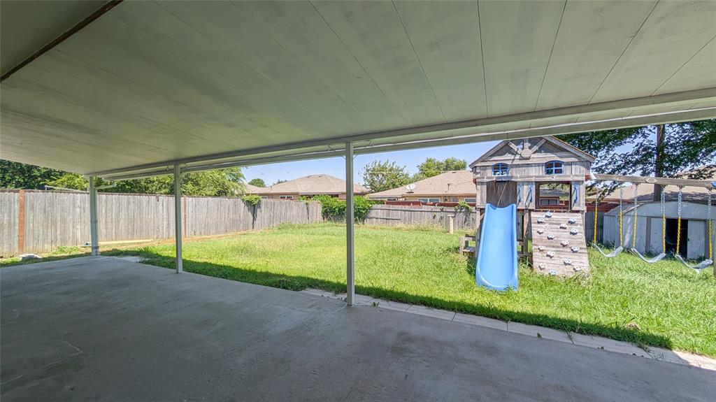 1107 Waverly Drive Arlington, TX 76015 - Photo 18 of 20 a view of a house with a street