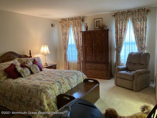 40 Rainier Drive Brick, NJ 08724 - Photo 13 of 25 a bedroom with a bed and a couch