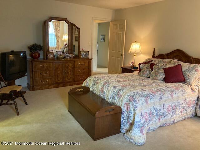 40 Rainier Drive Brick, NJ 08724 - Photo 14 of 25 a bedroom with a bed couch and dresser