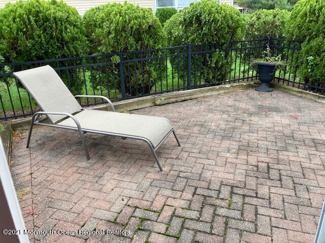 40 Rainier Drive Brick, NJ 08724 - Photo 22 of 25 a view of backyard with a table and chairs