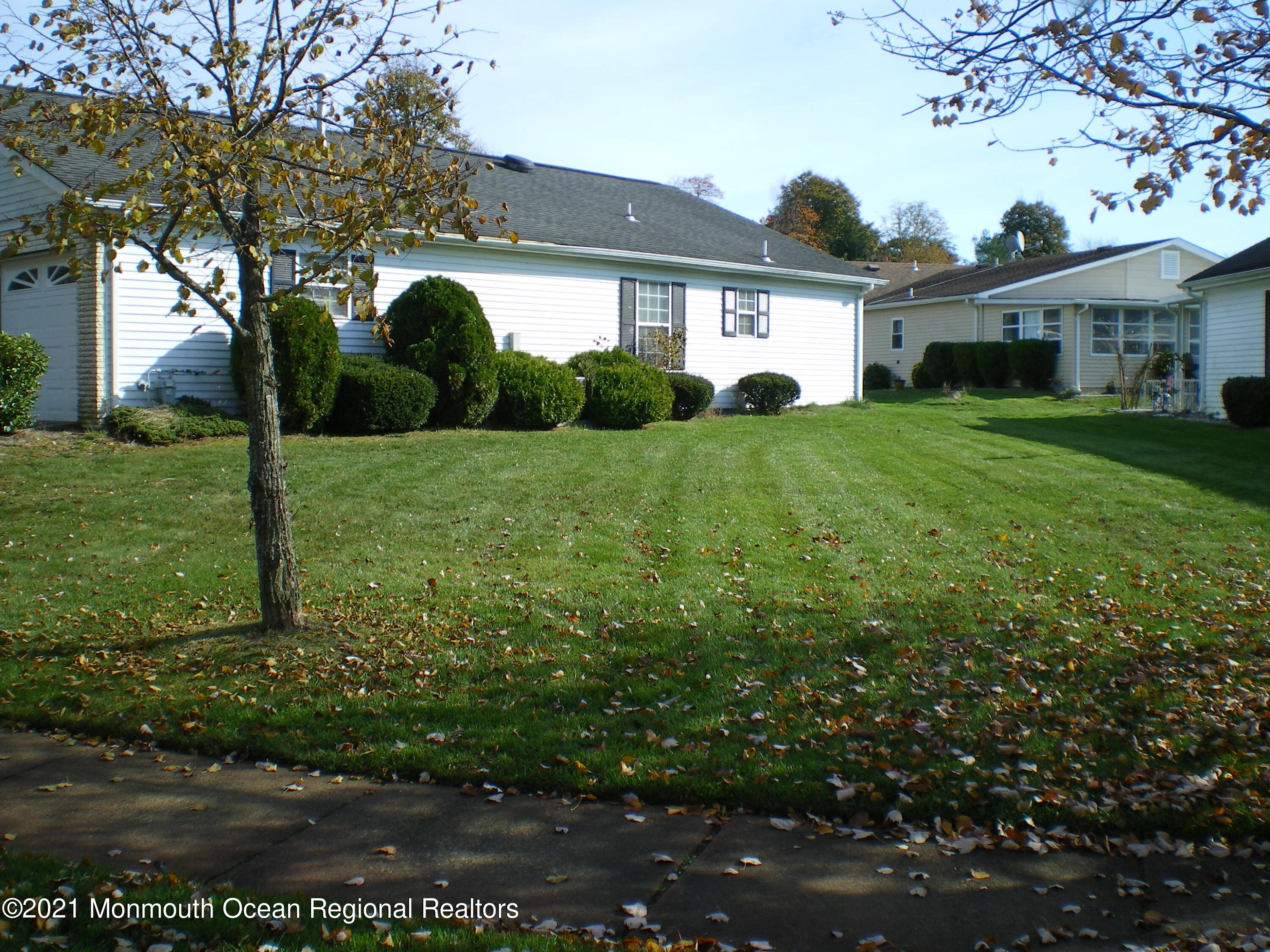 40 Rainier Drive Brick, NJ 08724 - Photo 23 of 25 a front view of a house with a yard